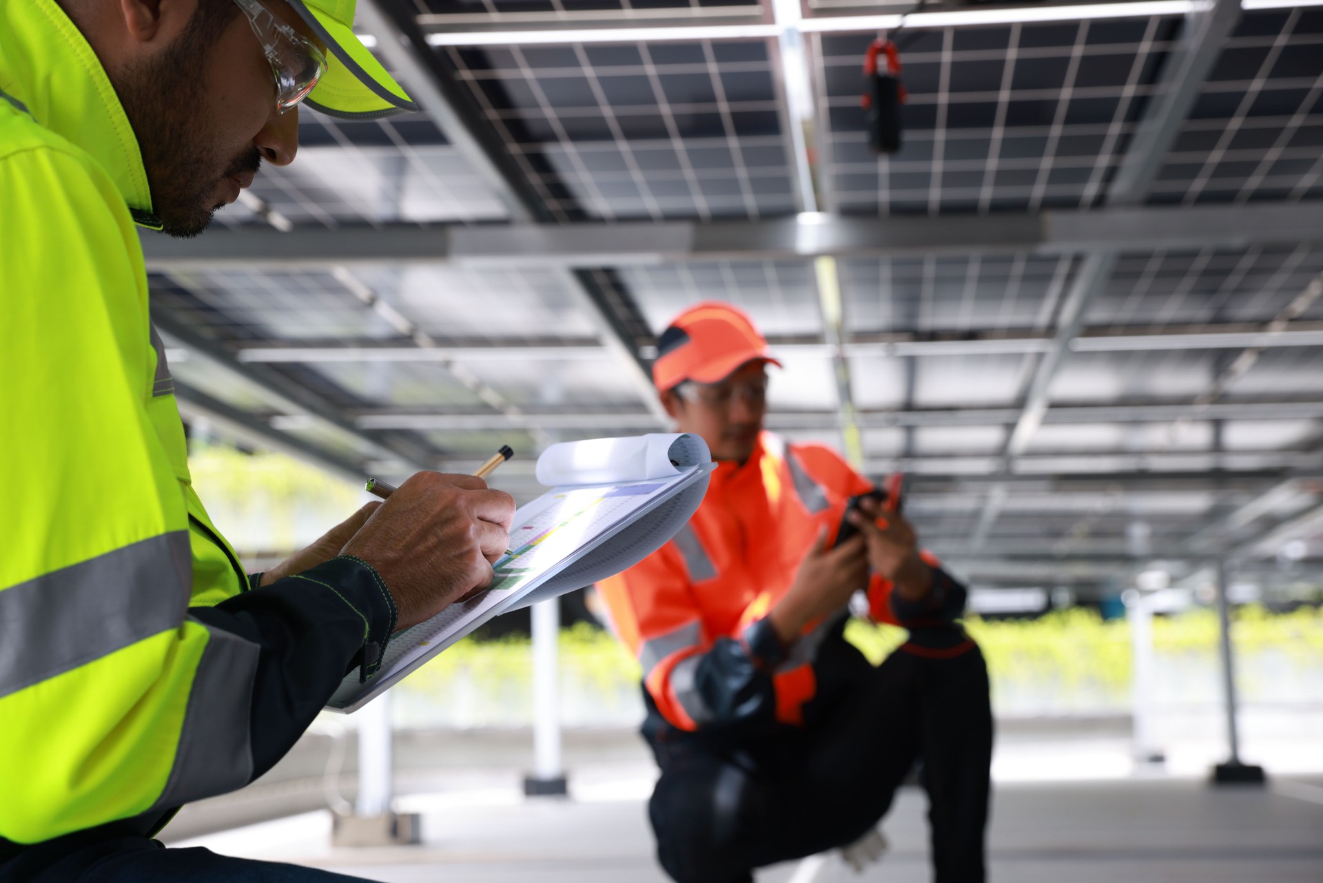 Solar engineer or electrical technician check amp and voltage and connect electrical wiring of solar panel and control unite, new technology alternative energy, sustainable energy investment